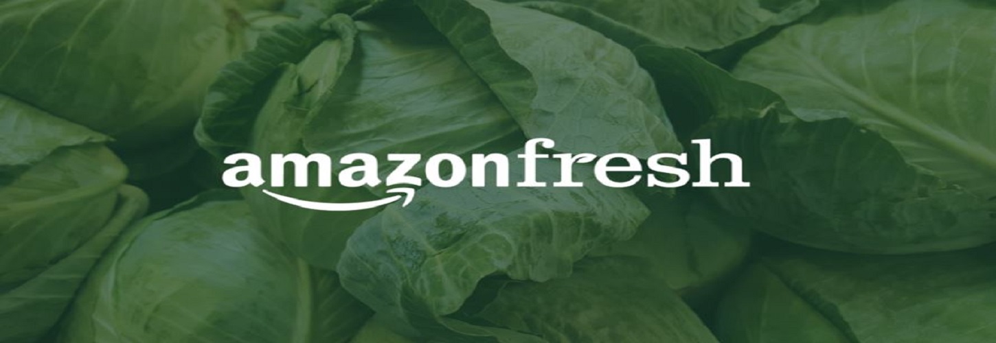 Amazonfresh logo in front of green lettuce heads 